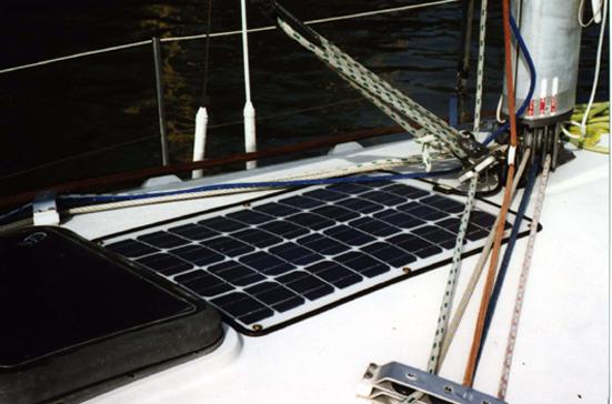 The panel screwed to the deck abaft the mast, requiring a slight bowing that is accommodated by the unit