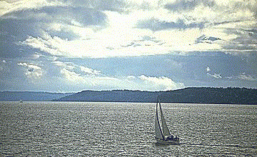 Sail off into the Sunset image of a yacht, sailing away